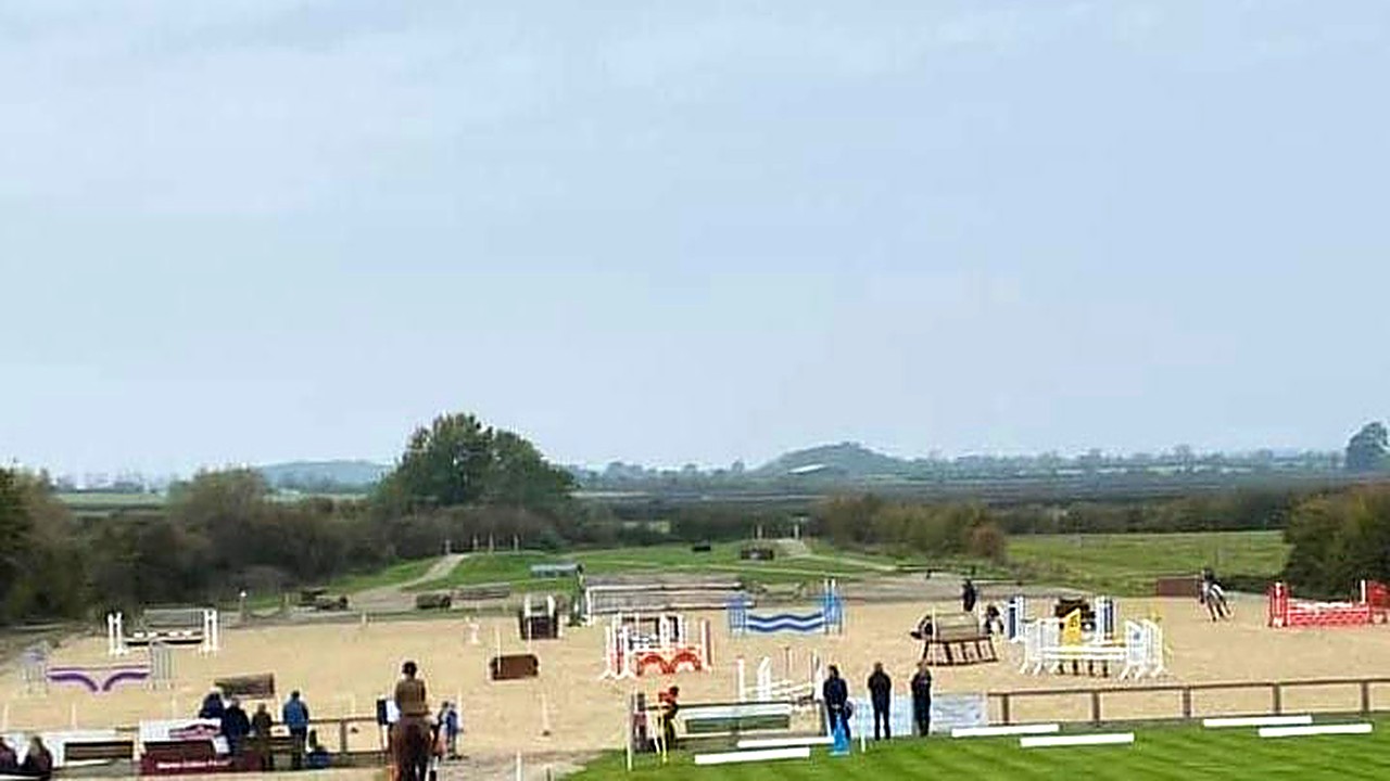 An elevated view of the outdoor arena and cross country course at Wickstead Farm during a show